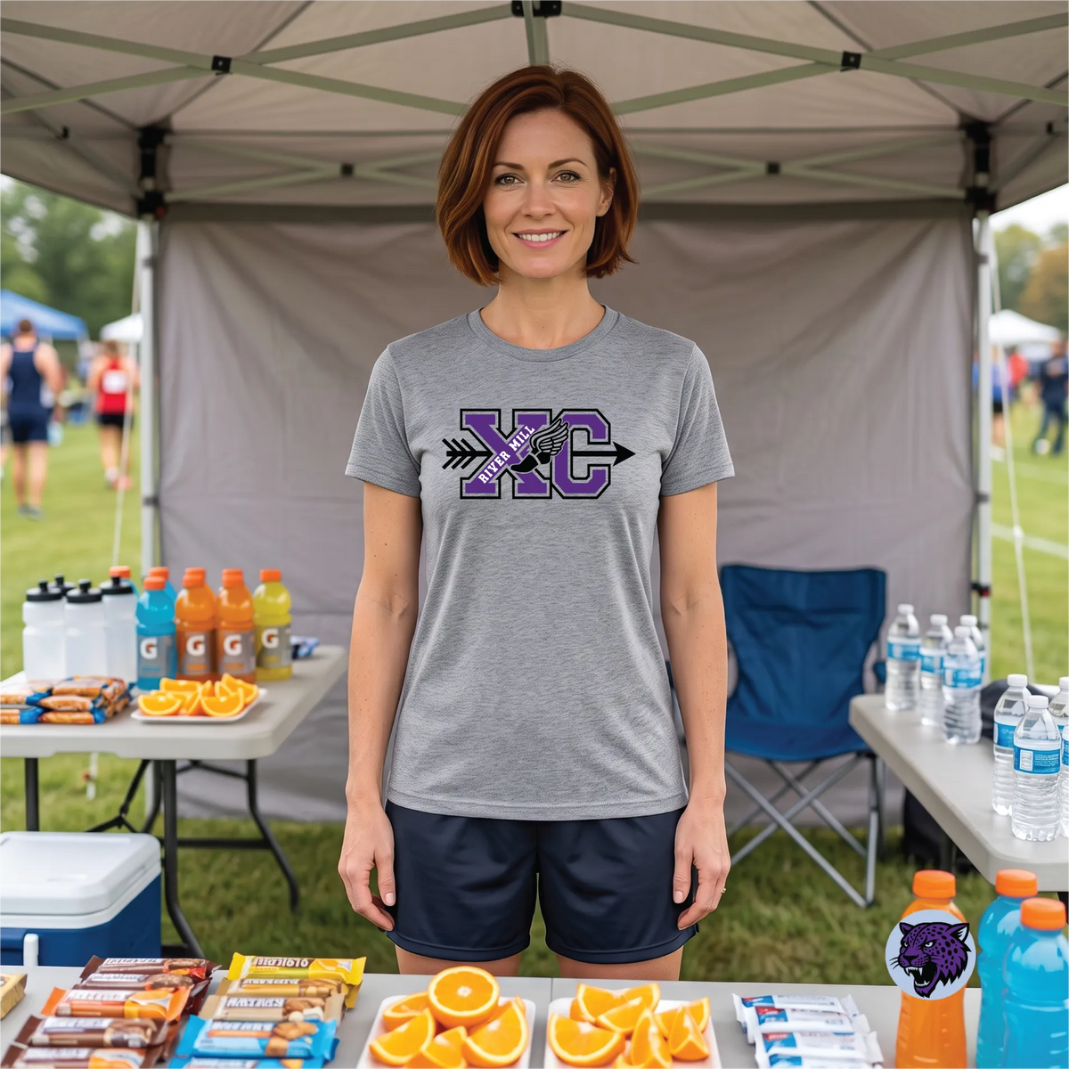 A model wearing the River Mill Academy Cross Country Trail Tee.